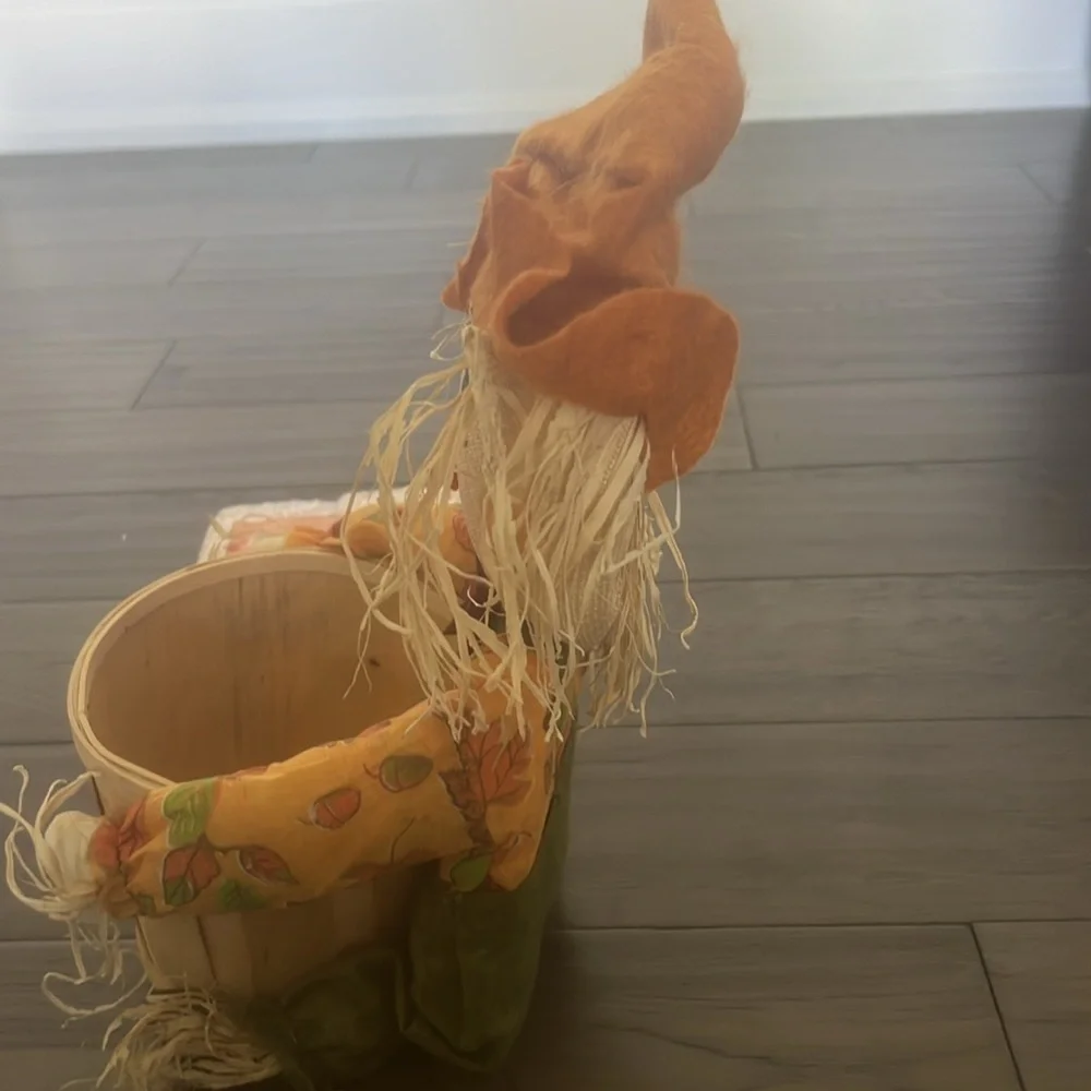 Scarecrow figurine with straw Bale